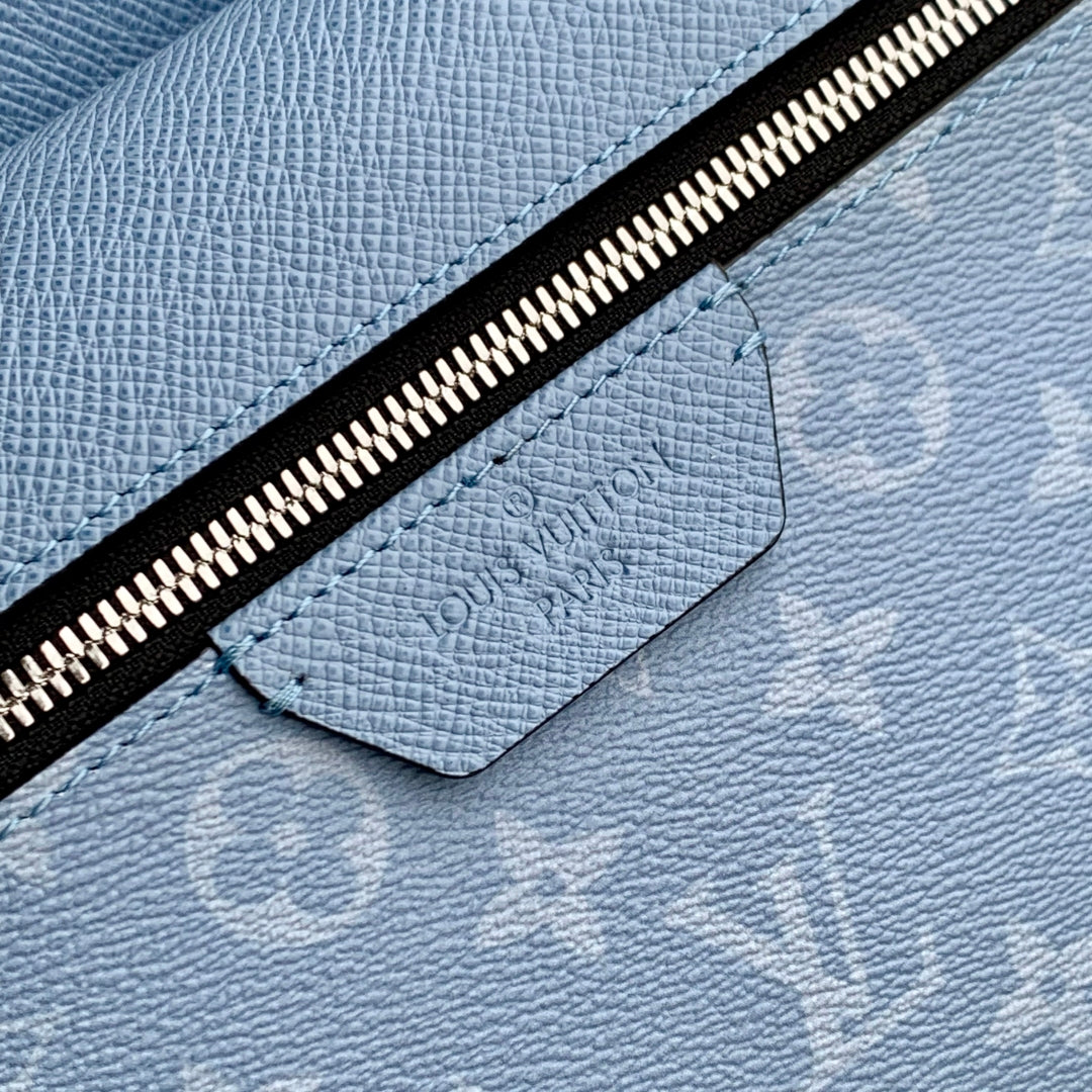 DISCOVERY SLIM BACKPACK 38 BLUE MONOGRAM COATED CANVAS AND CALFSKIN