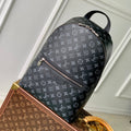 DISCOVERY SLIM BACKPACK 38 IN BLACK MONOGRAM ECLIPSE COATED CALFSKIN