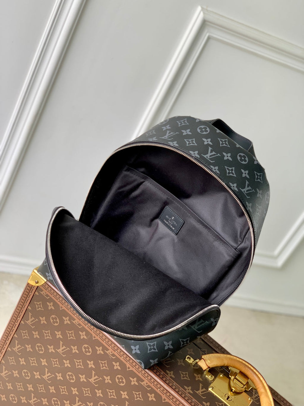 DISCOVERY SLIM BACKPACK 38 IN BLACK MONOGRAM ECLIPSE COATED CALFSKIN