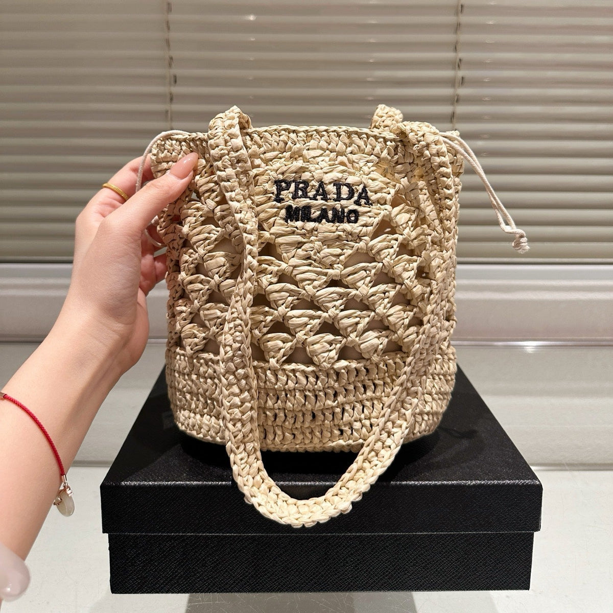 CROCHET BUCKET BAG 18 IN BEIGE WOVEN RAFFIA EMBROIDED LOGO