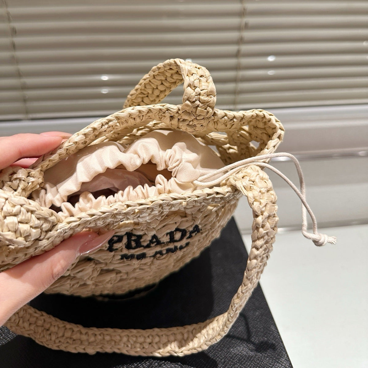 CROCHET BUCKET BAG 18 IN BEIGE WOVEN RAFFIA EMBROIDED LOGO